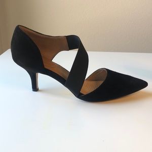 Black suede heel with strap across instep